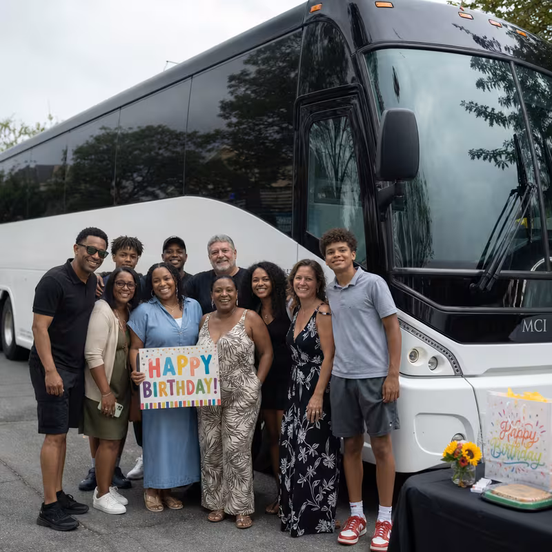 Passengers loading luggage while boarding an Hialeah group shuttle