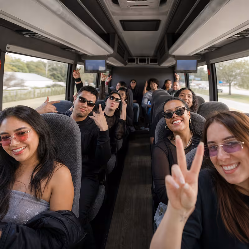 Party bus interior with wraparound leather seating and LED lighting in Hialeah