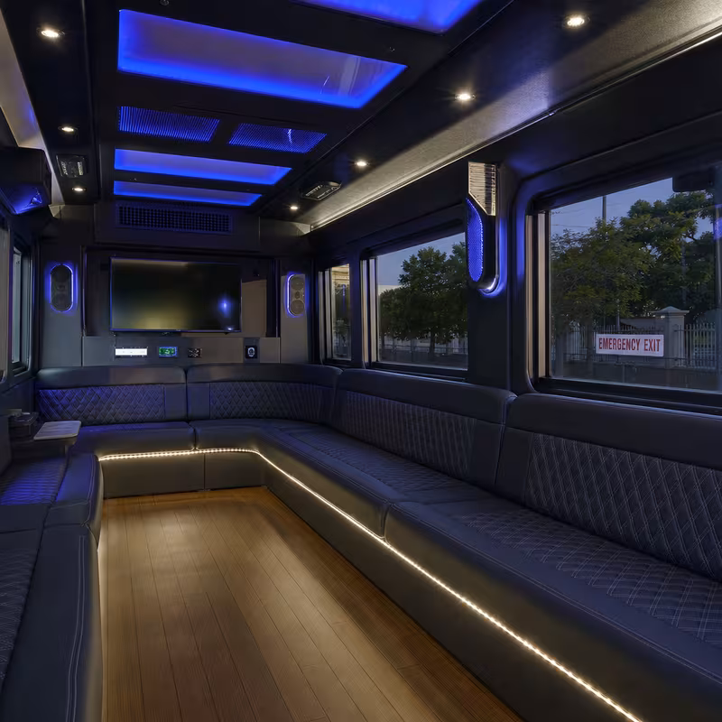 Party bus interior with wraparound leather seating and LED lighting in Hialeah