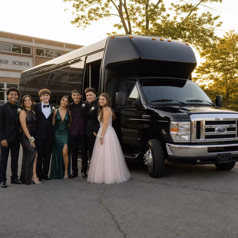 Group boarding a white charter bus for Prom & Homecoming Transportation transportation in Hialeah