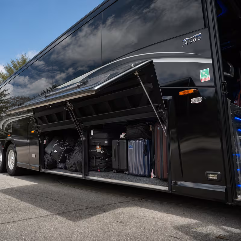 Party bus interior with wraparound leather seating and LED lighting in Hialeah